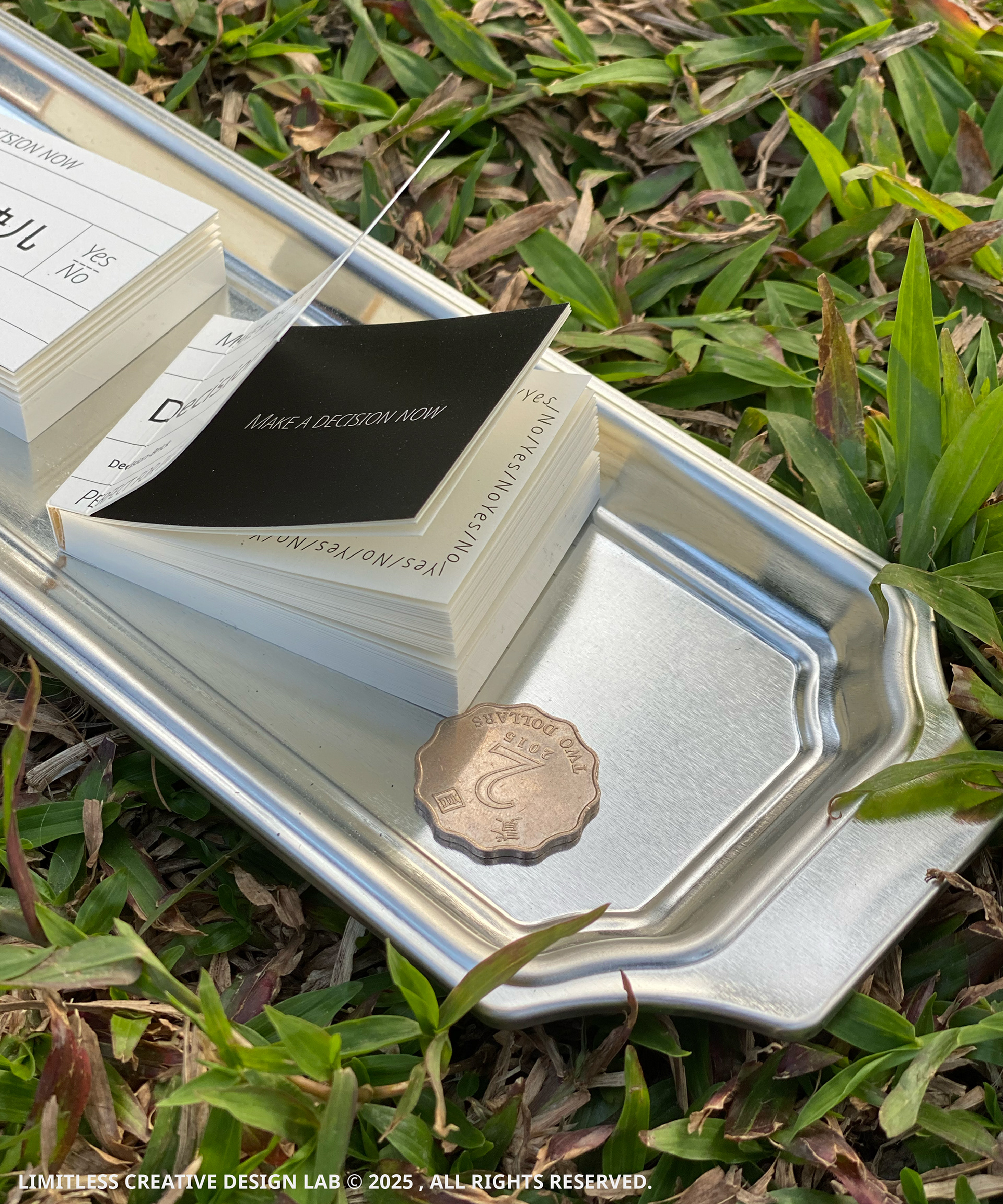 An open Decision Block and a coin, showing the pages and thickness of the paper.