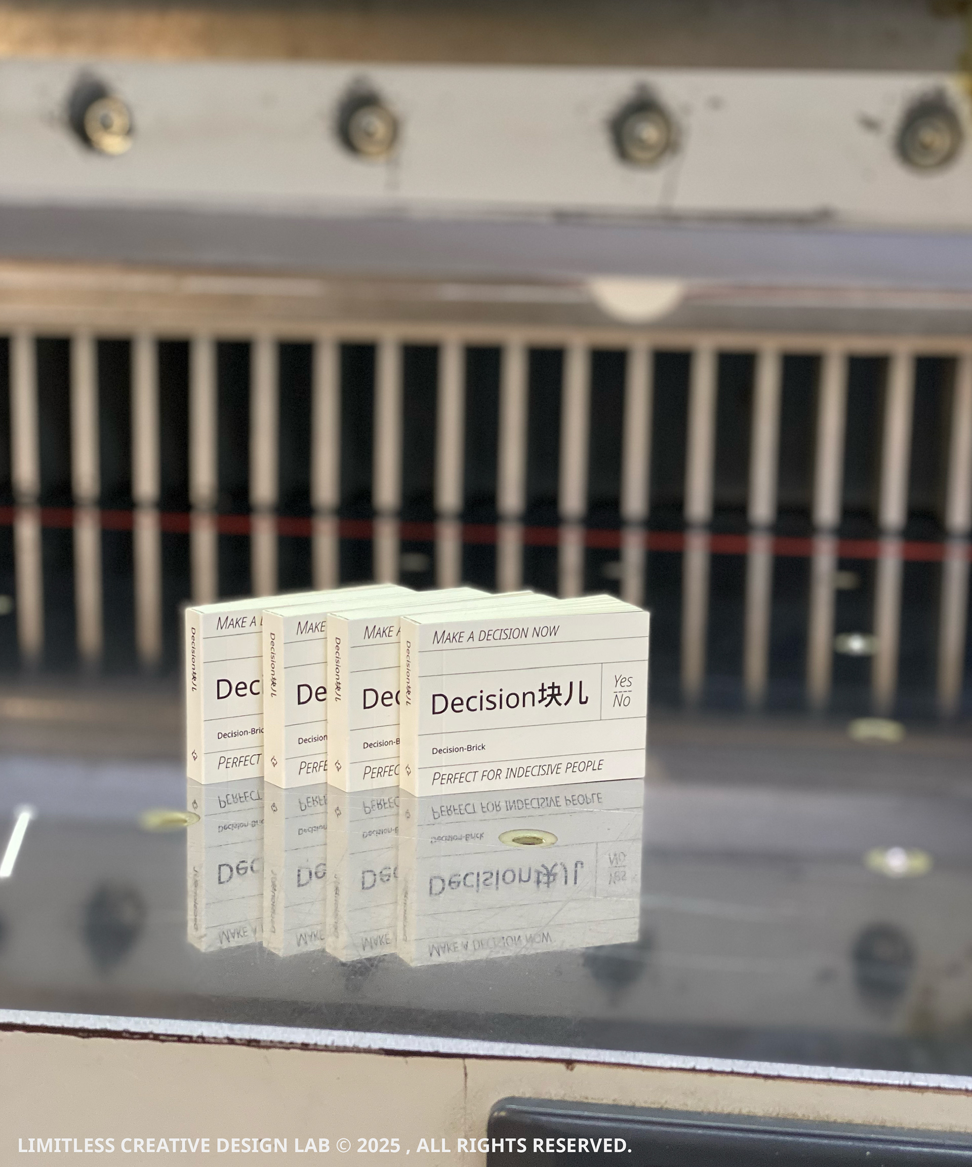 A row of Decision Block books in front of paper-cutting equipment.